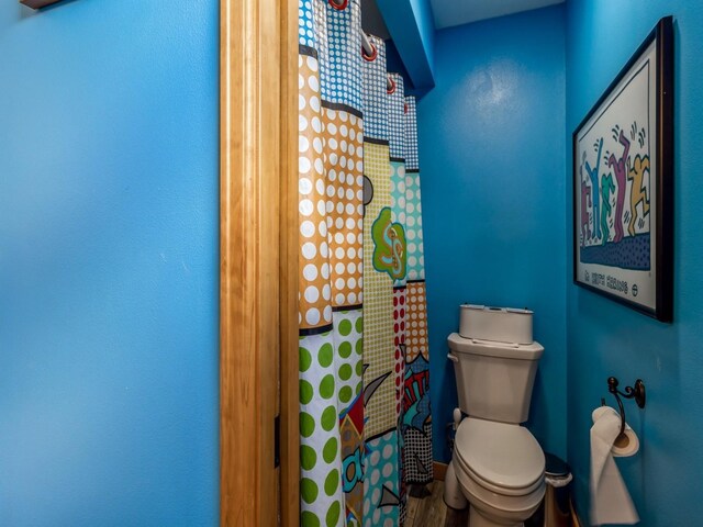 470 Juniper Ave, Kellogg, IA 50135 - full bath featuring toilet and wood finished floors
