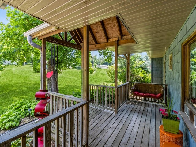 470 Juniper Ave, Kellogg, IA 50135 - porch featuring a lawn