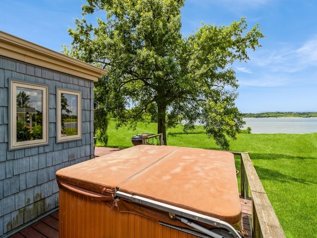 470 Juniper Ave, Kellogg, IA 50135 - wooden terrace featuring a hot tub, a water view, and a yard