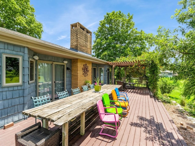 470 Juniper Ave, Kellogg, IA 50135 - wooden terrace featuring outdoor dining space and a pergola