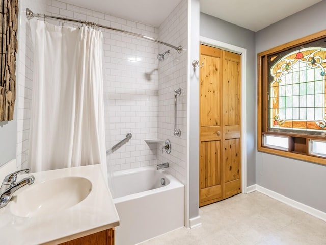 470 Juniper Ave, Kellogg, IA 50135 - bathroom with shower / bath combo with shower curtain, vanity, and tile patterned floors