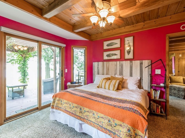 470 Juniper Ave, Kellogg, IA 50135 - carpeted bedroom featuring a wooden ceiling with exposed beams, access to exterior, and ceiling fan