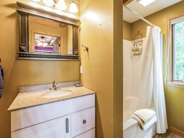 470 Juniper Ave, Kellogg, IA 50135 - bathroom featuring vanity and shower / bathtub combination with curtain
