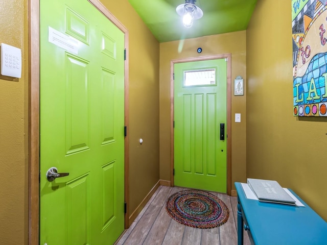 470 Juniper Ave, Kellogg, IA 50135 - entryway featuring wood finished floors and baseboards