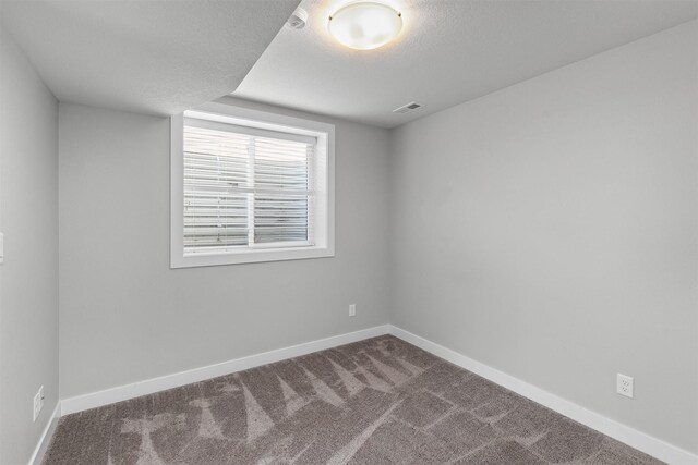15321 Goldenrod Dr, Urbandale, IA 50323 - spare room with carpet floors and a textured ceiling