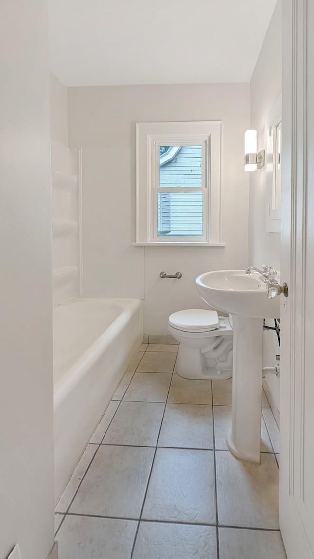 343 58th St, Des Moines, IA 50312 - full bathroom featuring toilet and tile patterned floors