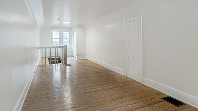 343 58th St, Des Moines, IA 50312 - additional living space featuring wood finished floors and lofted ceiling