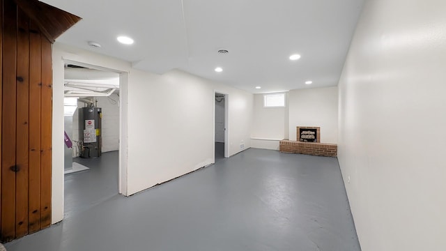 343 58th St, Des Moines, IA 50312 - below grade area featuring water heater and recessed lighting