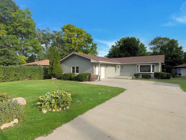 1410 Thomas St, Redfield, IA 50233 - single story home featuring driveway, a front lawn, and a garage
