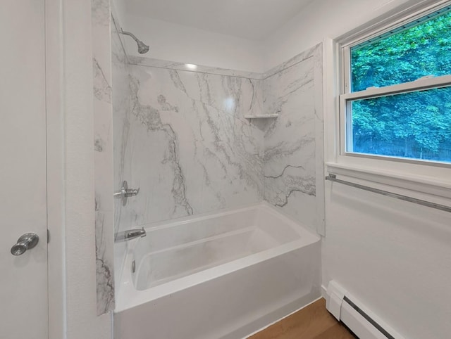 1410 Thomas St, Redfield, IA 50233 - bathroom with baseboard heating and washtub / shower combination