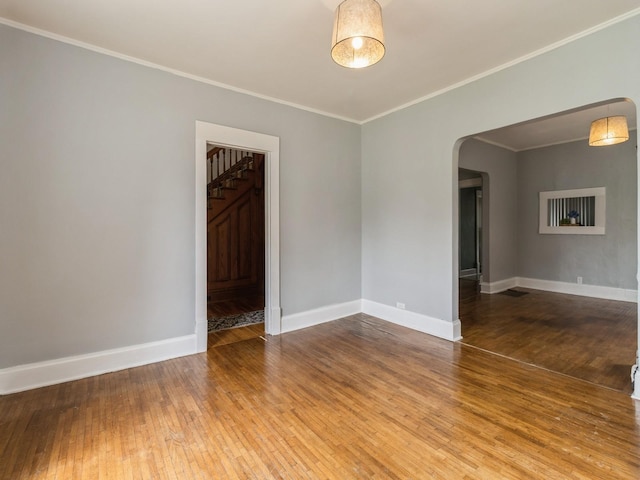 700 W Boston Ave, Indianola, IA 50125 - spare room with arched walkways, wood-type flooring, and ornamental molding