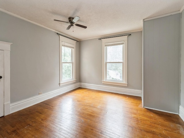 700 W Boston Ave, Indianola, IA 50125 - empty room with hardwood / wood-style floors, ornamental molding, ceiling fan, and a textured ceiling