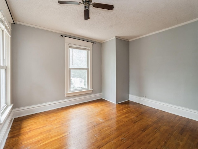 700 W Boston Ave, Indianola, IA 50125 - unfurnished room with wood finished floors, ceiling fan, a textured ceiling, and ornamental molding