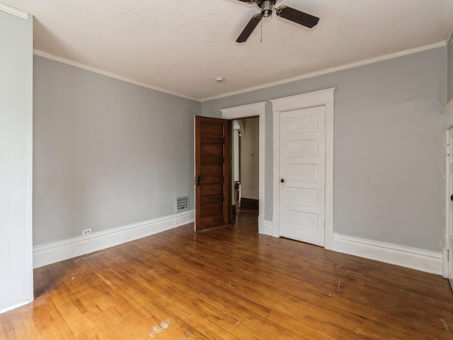 700 W Boston Ave, Indianola, IA 50125 - spare room with wood finished floors, ceiling fan, and crown molding