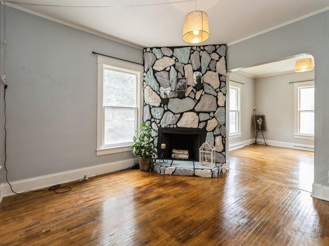 700 W Boston Ave, Indianola, IA 50125 - living area with crown molding, hardwood / wood-style flooring, a fireplace, and a baseboard radiator