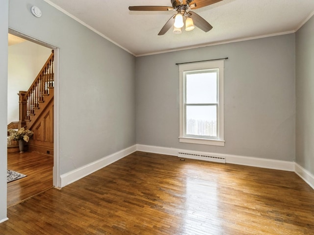 700 W Boston Ave, Indianola, IA 50125 - spare room featuring ornamental molding, hardwood / wood-style floors, ceiling fan, a smoke detector, and stairway