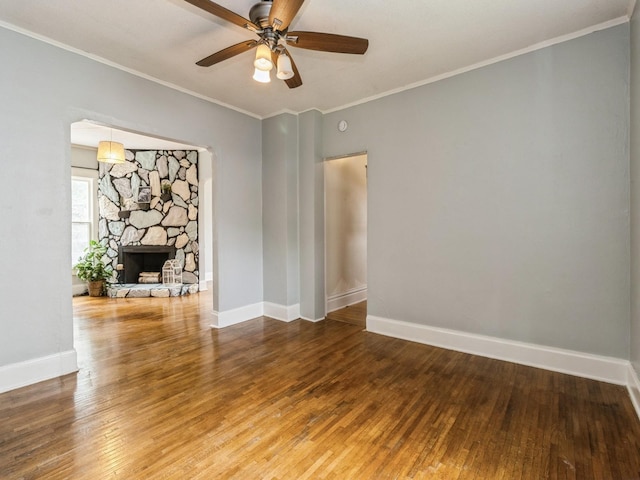 700 W Boston Ave, Indianola, IA 50125 - unfurnished room featuring wood-type flooring, a ceiling fan, a fireplace, and ornamental molding