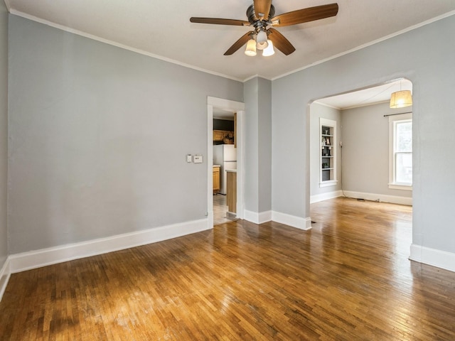 700 W Boston Ave, Indianola, IA 50125 - empty room featuring wood-type flooring, a ceiling fan, and crown molding