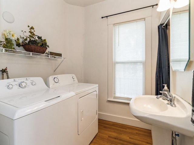 700 W Boston Ave, Indianola, IA 50125 - laundry room featuring separate washer and dryer and light wood-style floors