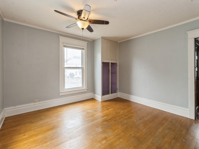 700 W Boston Ave, Indianola, IA 50125 - unfurnished room with light wood finished floors, ceiling fan, and crown molding
