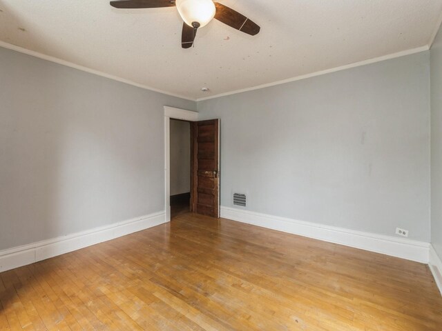 700 W Boston Ave, Indianola, IA 50125 - unfurnished room with wood-type flooring, ceiling fan, and crown molding