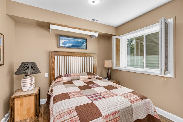 1592 SE Blackthorne Dr, Waukee, IA 50263 - bedroom with baseboards and wood finished floors