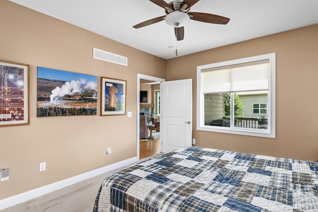 1592 SE Blackthorne Dr, Waukee, IA 50263 - carpeted bedroom with baseboards and ceiling fan