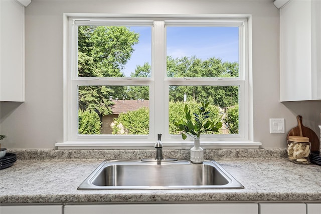 8066 Pilmer Dr, Des Moines, IA 50320 - kitchen with white cabinets and light countertops