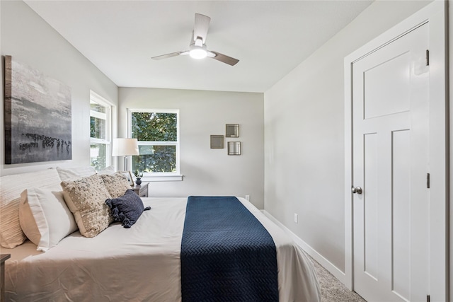8066 Pilmer Dr, Des Moines, IA 50320 - carpeted bedroom with baseboards and ceiling fan