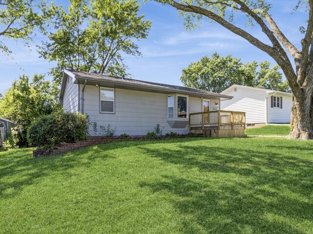 4518 SE 6th St, Des Moines, IA 50315 - back of house featuring a yard and a deck