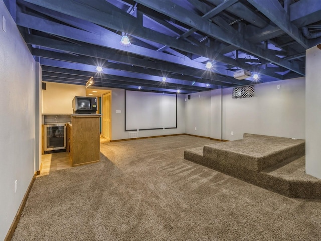 4518 SE 6th St, Des Moines, IA 50315 - carpeted home theater featuring bar and beverage cooler