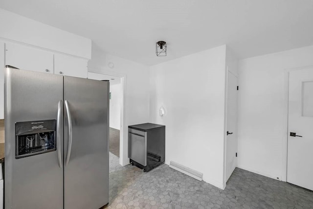 3017 Lincoln Way, Ames, IA 50014 - kitchen featuring stainless steel fridge with ice dispenser and white cabinetry