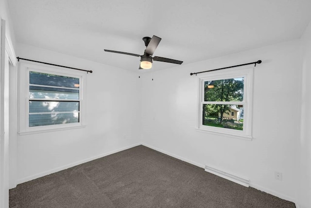 3017 Lincoln Way, Ames, IA 50014 - spare room featuring dark colored carpet and a ceiling fan