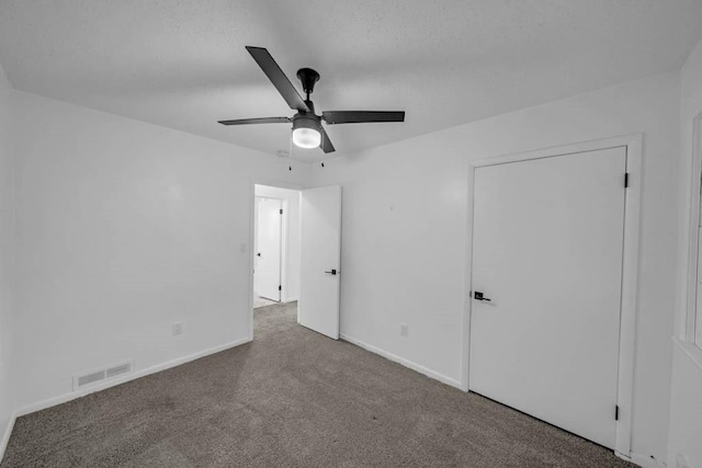 3017 Lincoln Way, Ames, IA 50014 - unfurnished bedroom with carpet floors and ceiling fan