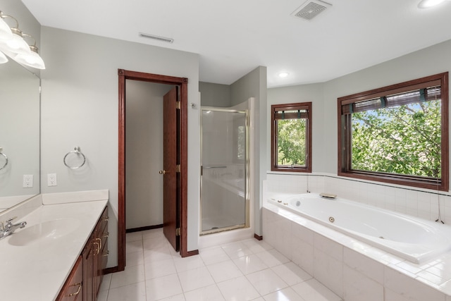 3124 Greenwood Rd, Ames, IA 50014 - full bathroom with vanity, a shower stall, a tub with jets, and tile patterned floors