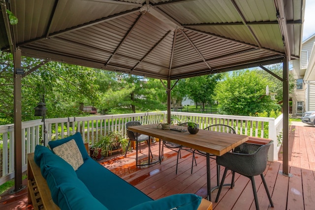 3124 Greenwood Rd, Ames, IA 50014 - wooden deck featuring outdoor dining space, a gazebo, and an outdoor hangout area