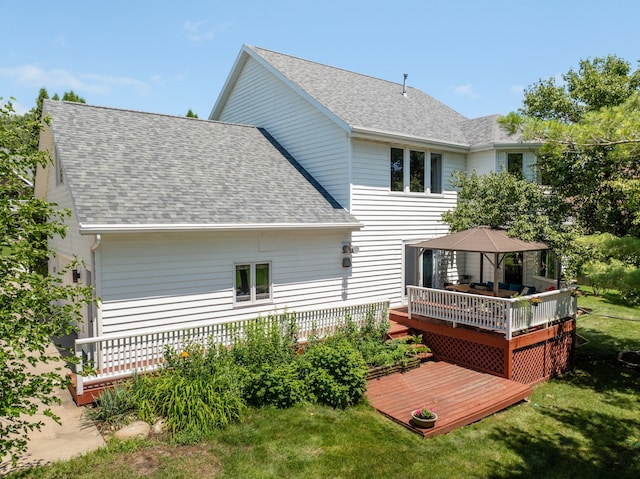 3124 Greenwood Rd, Ames, IA 50014 - rear view of house featuring a gazebo, a shingled roof, a deck, and a yard