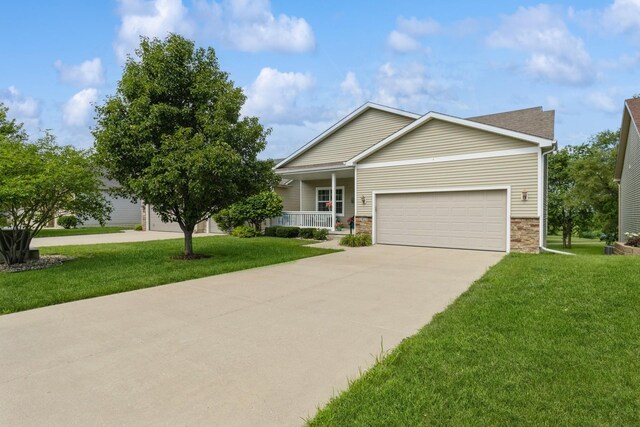 1921 Bristol St, Norwalk, IA 50211 - view of front facade with covered porch, a front yard, driveway, and a garage