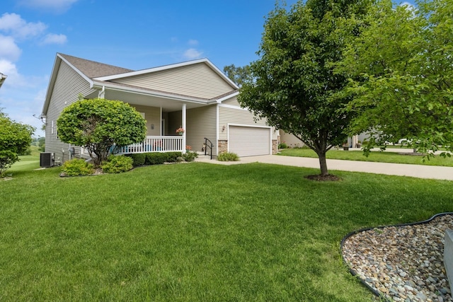 1921 Bristol St, Norwalk, IA 50211 - view of front of house featuring covered porch, a front lawn, an attached garage, and driveway