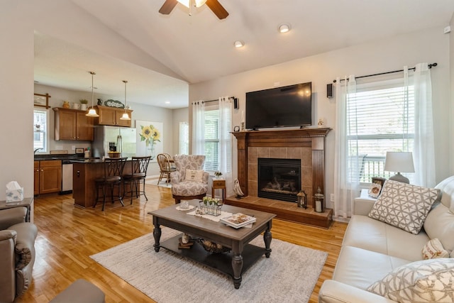 1921 Bristol St, Norwalk, IA 50211 - living area featuring a ceiling fan, light wood-style flooring, lofted ceiling, a fireplace, and recessed lighting