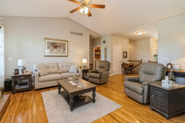 1921 Bristol St, Norwalk, IA 50211 - living room featuring a ceiling fan, vaulted ceiling, and light wood finished floors