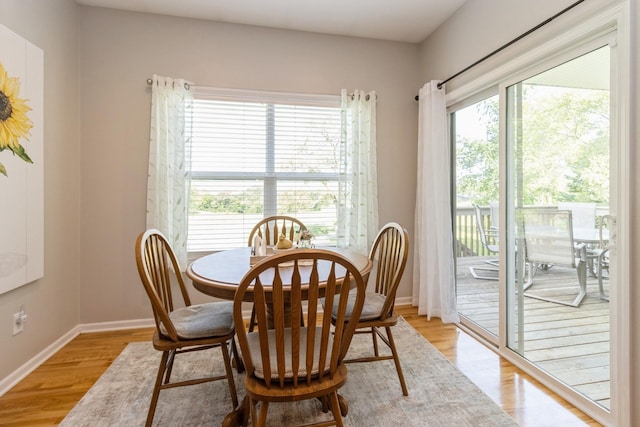 1921 Bristol St, Norwalk, IA 50211 - dining area featuring light wood-type flooring and baseboards