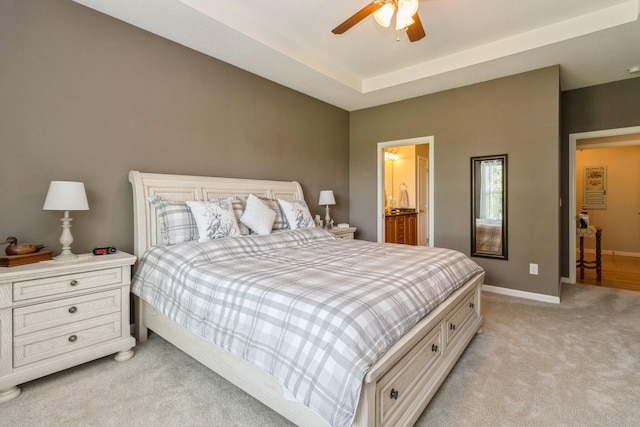 1921 Bristol St, Norwalk, IA 50211 - bedroom with light colored carpet, a ceiling fan, and ensuite bathroom