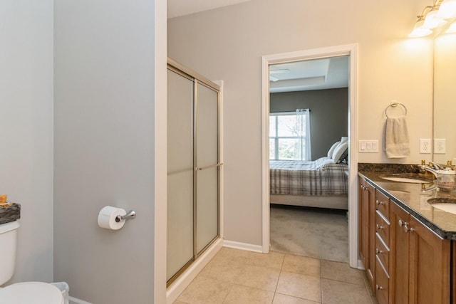 1921 Bristol St, Norwalk, IA 50211 - ensuite bathroom with a shower stall, double vanity, and tile patterned flooring