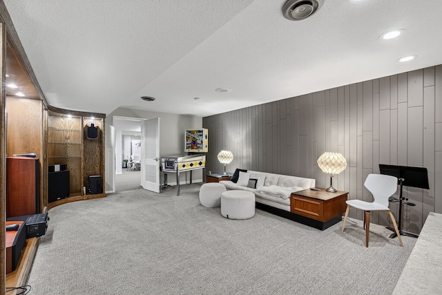 4130 Beaver Ave, Des Moines, IA 50310 - living area featuring carpet flooring, a textured ceiling, recessed lighting, and wood walls