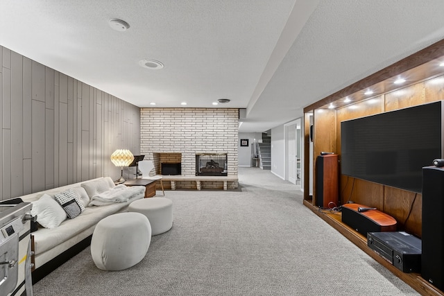 4130 Beaver Ave, Des Moines, IA 50310 - living area featuring wood walls, a fireplace, carpet floors, and a textured ceiling