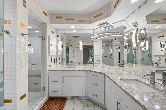 4130 Beaver Ave, Des Moines, IA 50310 - bathroom with vanity, a shower stall, marble look tile flooring, and recessed lighting