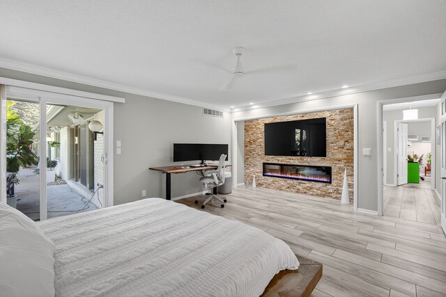 4130 Beaver Ave, Des Moines, IA 50310 - bedroom featuring crown molding, access to exterior, light wood finished floors, a glass covered fireplace, and a ceiling fan