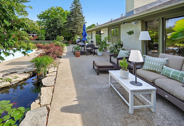 4130 Beaver Ave, Des Moines, IA 50310 - view of patio featuring outdoor dining space and outdoor lounge area