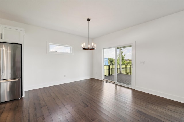1824 Bentley Ct, Norwalk, IA 50211 - unfurnished room with dark wood-type flooring and a chandelier